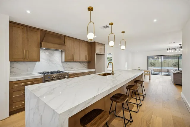 an open kitchen with a table and chairs in it