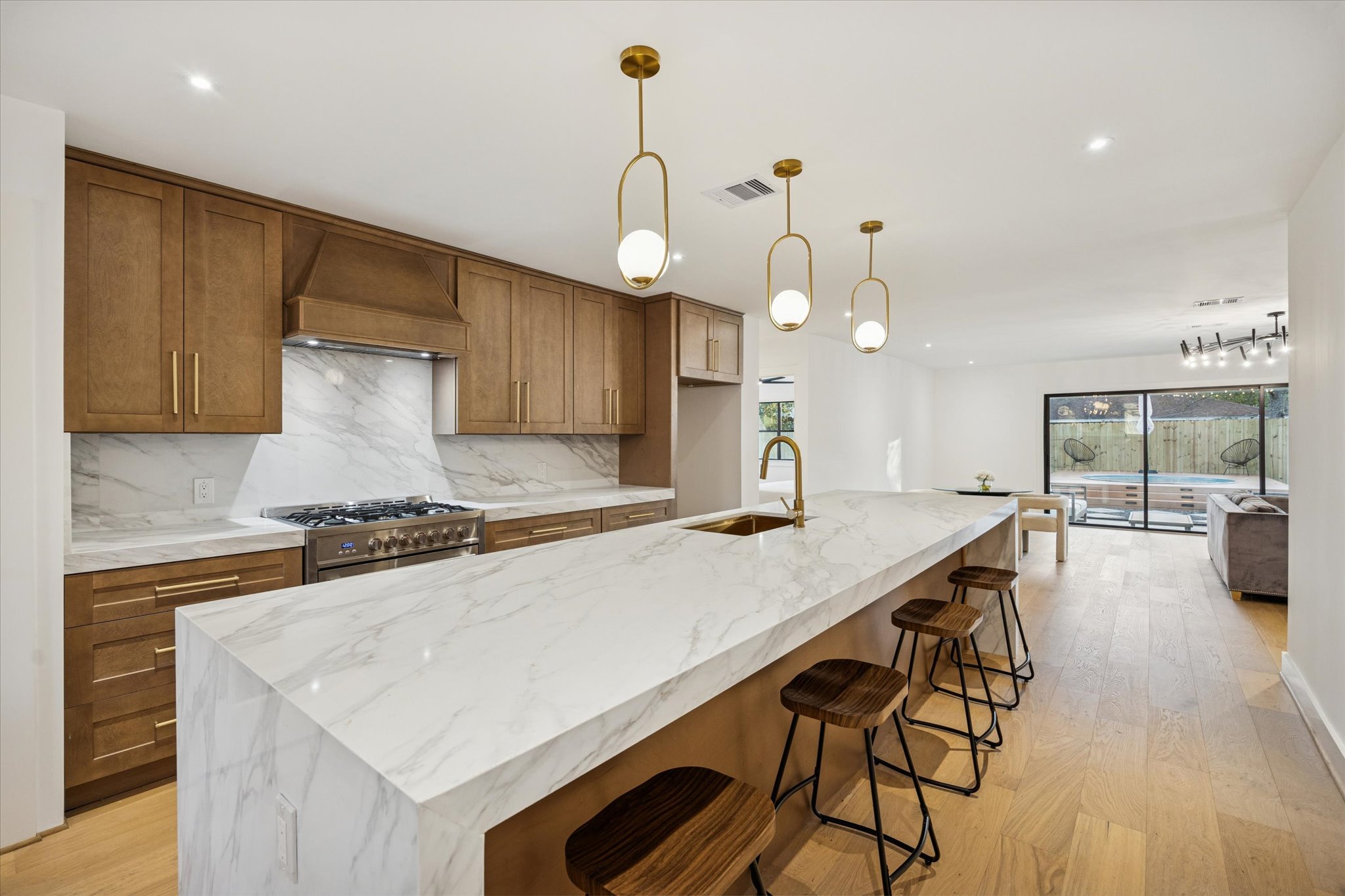 1611 Ridgehaven Drive Austin, TX 78723 - Photo 7 of 35 an open kitchen with a table and chairs in it