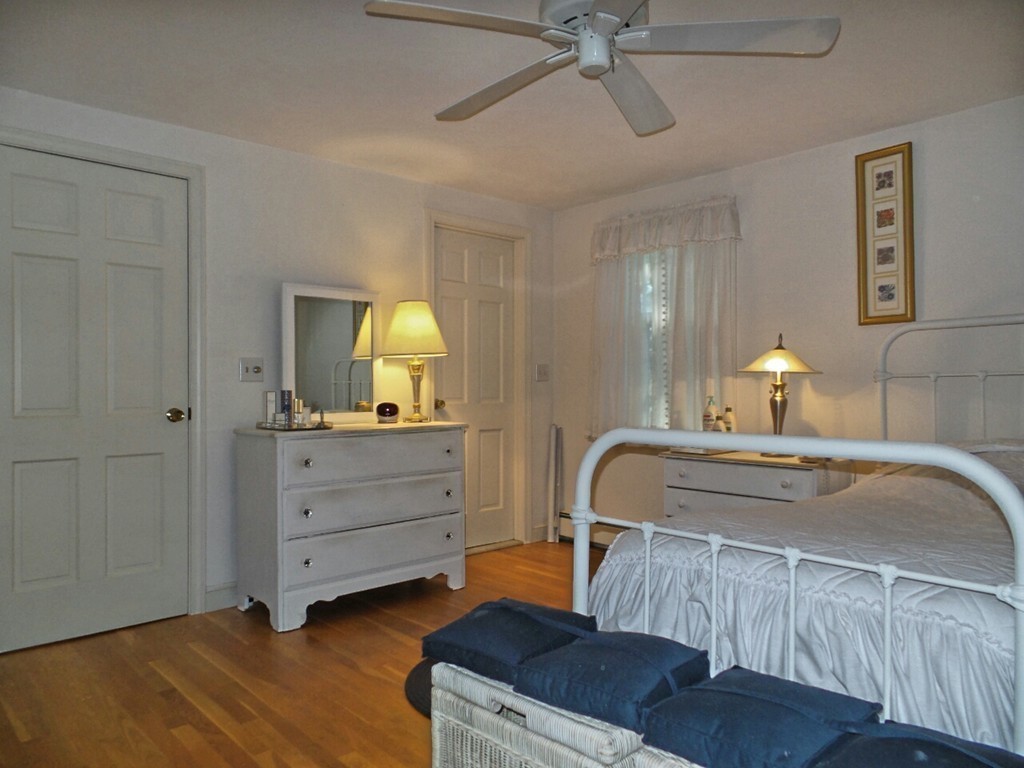 33 James Road Reading, MA 01867 - Photo 14 of 27 a bedroom with a bed and a dresser