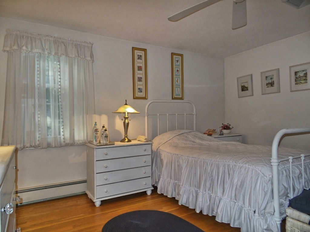 33 James Road Reading, MA 01867 - Photo 15 of 27 a bedroom with a bed and a dresser