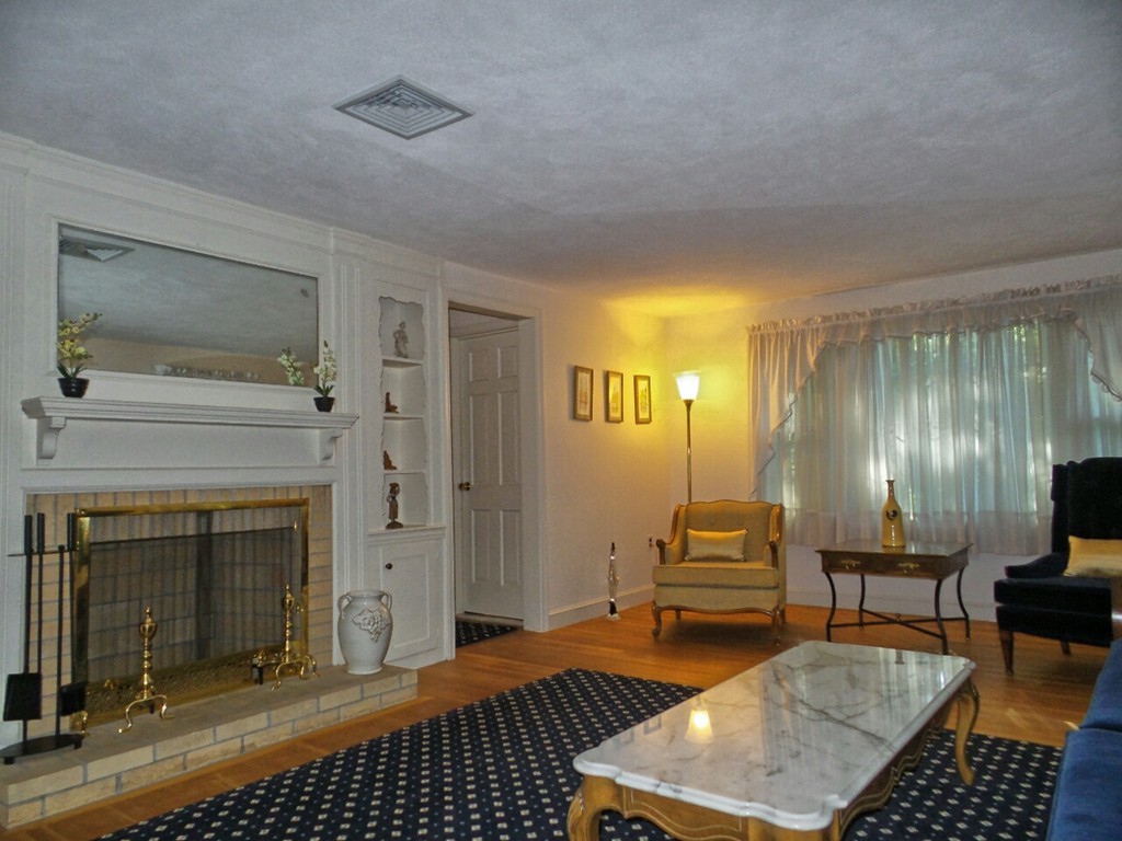 33 James Road Reading, MA 01867 - Photo 2 of 27 a living room with furniture