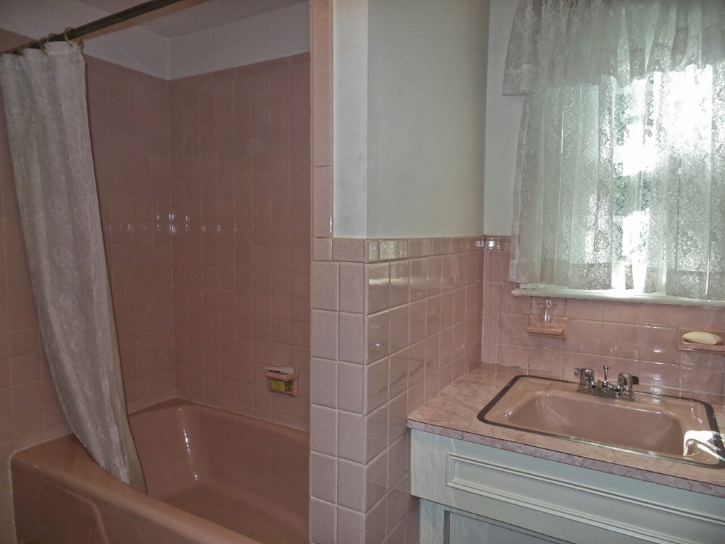 33 James Road Reading, MA 01867 - Photo 23 of 27 a bathroom with a sink and a bathtub