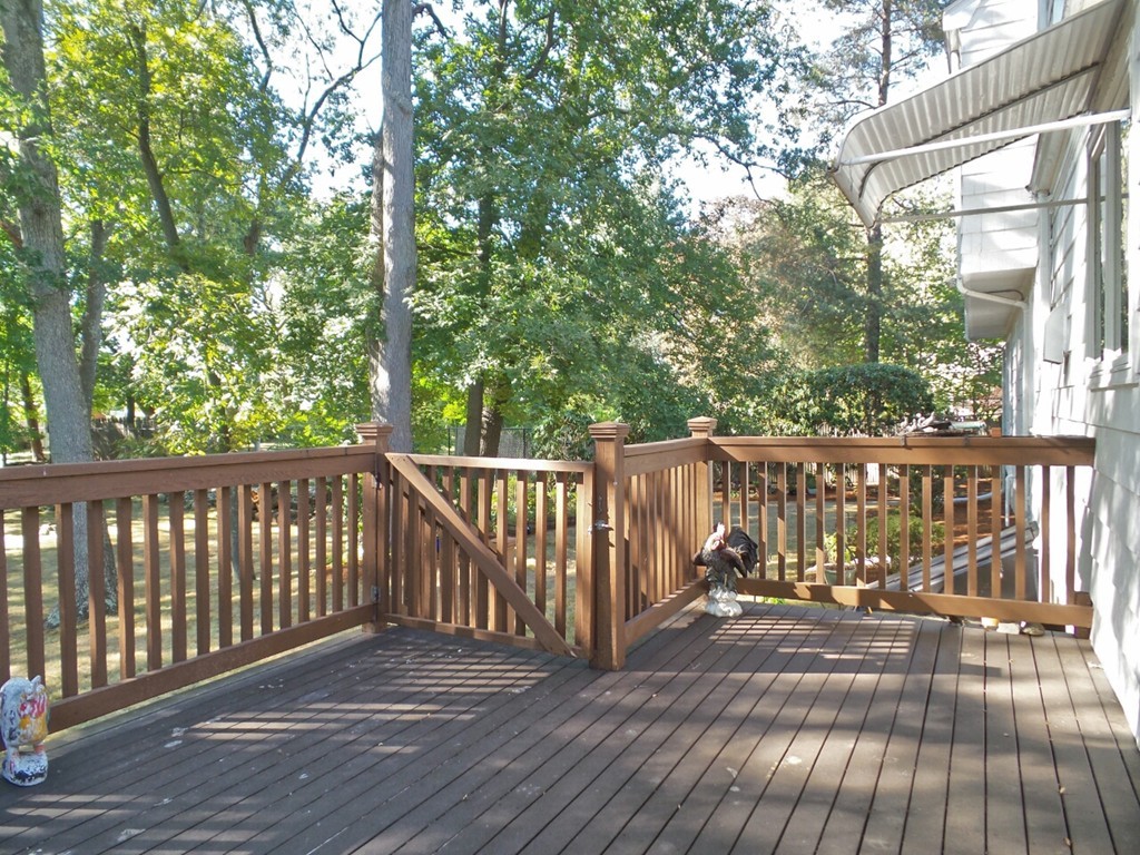 33 James Road Reading, MA 01867 - Photo 25 of 27 a balcony with wooden floor and outdoor seating