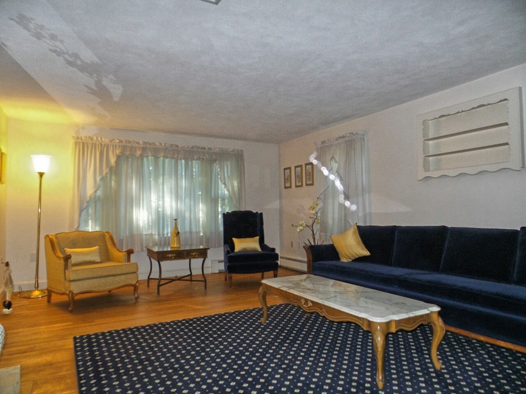 33 James Road Reading, MA 01867 - Photo 4 of 27 a living room with furniture
