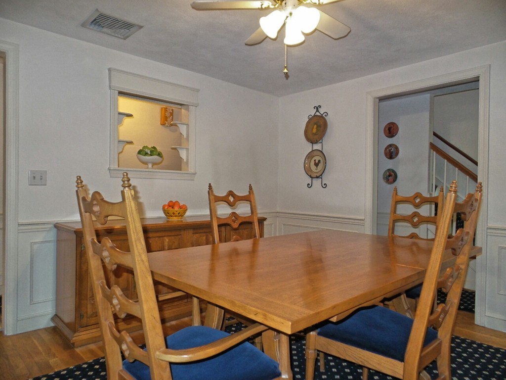 33 James Road Reading, MA 01867 - Photo 5 of 27 a view of a dining room with furniture and wooden floor