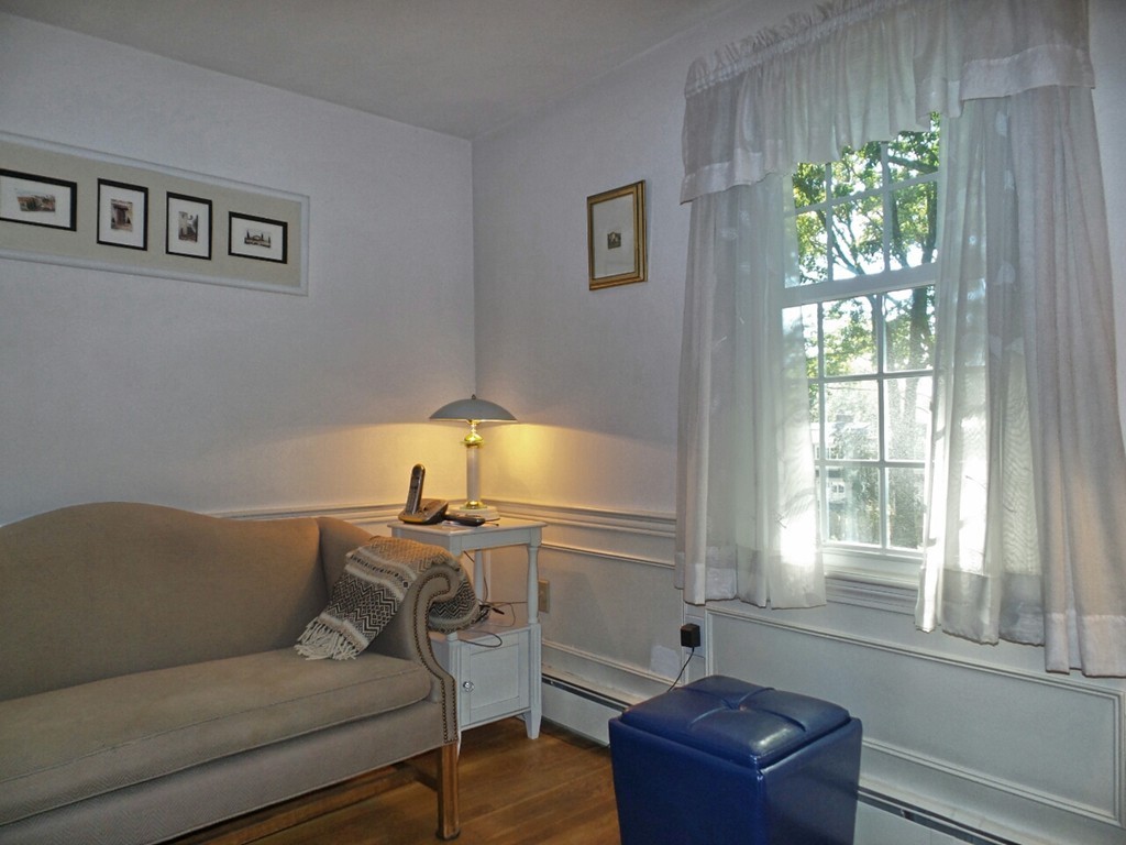 33 James Road Reading, MA 01867 - Photo 6 of 27 a living room with furniture and a window