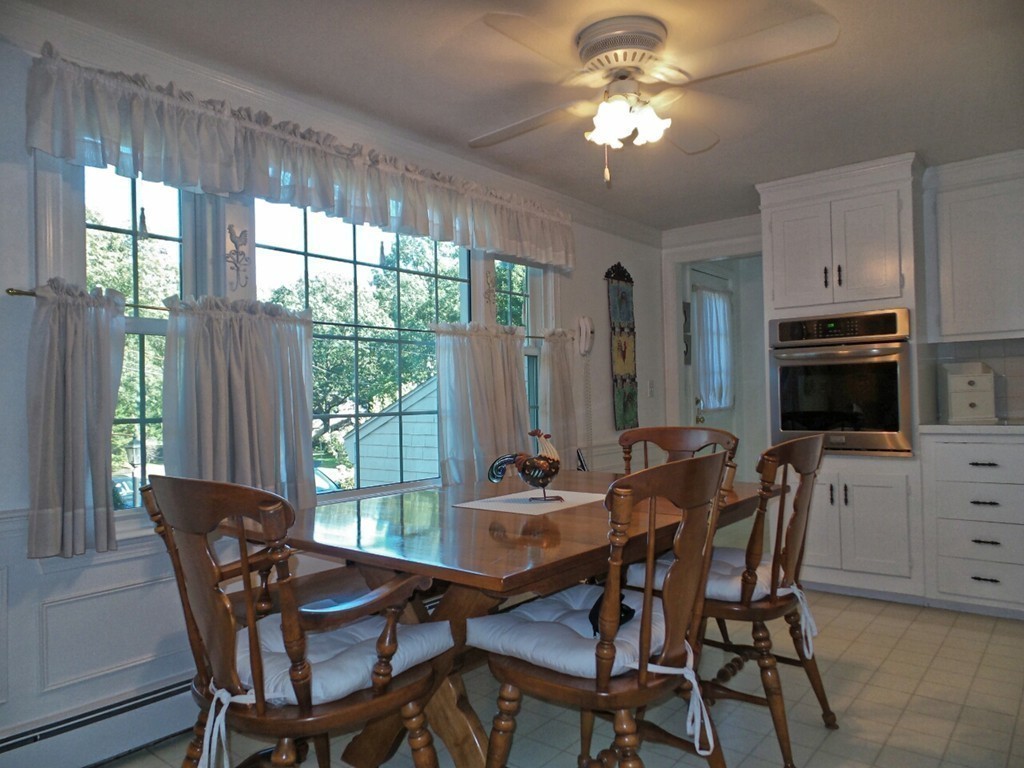33 James Road Reading, MA 01867 - Photo 9 of 27 a view of a dining room with furniture window and outside view