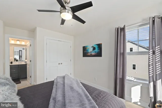 a view of a hallway with wooden floor and cabinet