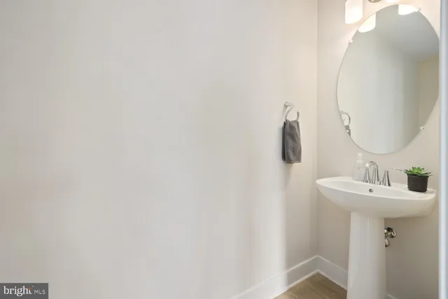 a bathroom with a sink and mirror