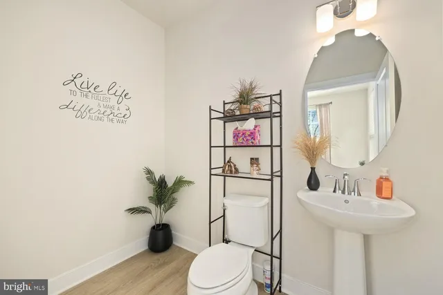 a view of a balcony with wooden floor and furniture