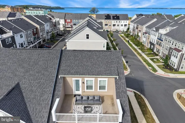 a front view of a residential apartment building with a yard