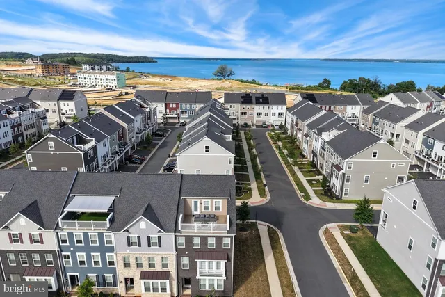 a view of multiple houses with a street
