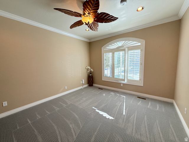1562 Fairway Ridge Road Draper, UT 84020 - Photo 32 of 60 Room featuring an arched window with plantation shutters, crown molding, and a decorative ceiling fan