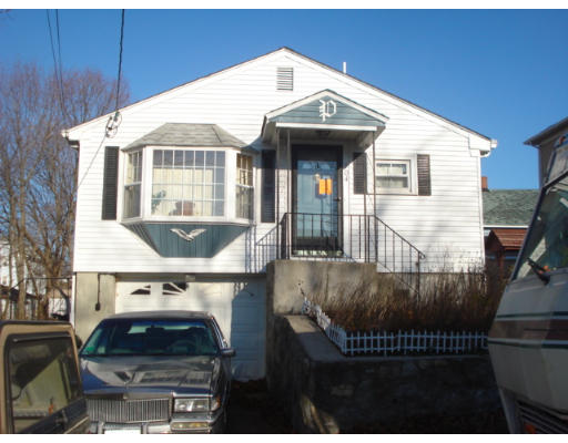104 Hamilton Street Woonsocket, RI 02895 - Photo 1 of 8 a front view of house with car parked