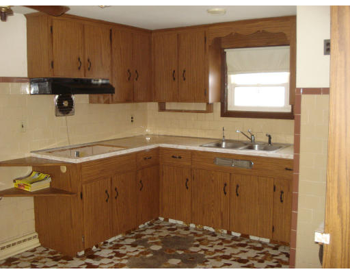 104 Hamilton Street Woonsocket, RI 02895 - Photo 3 of 8 a bathroom with a sink and a window