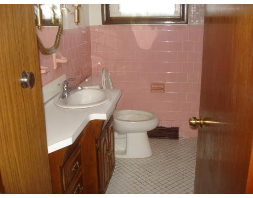 104 Hamilton Street Woonsocket, RI 02895 - Photo 6 of 8 a bathroom with a sink and a toilet