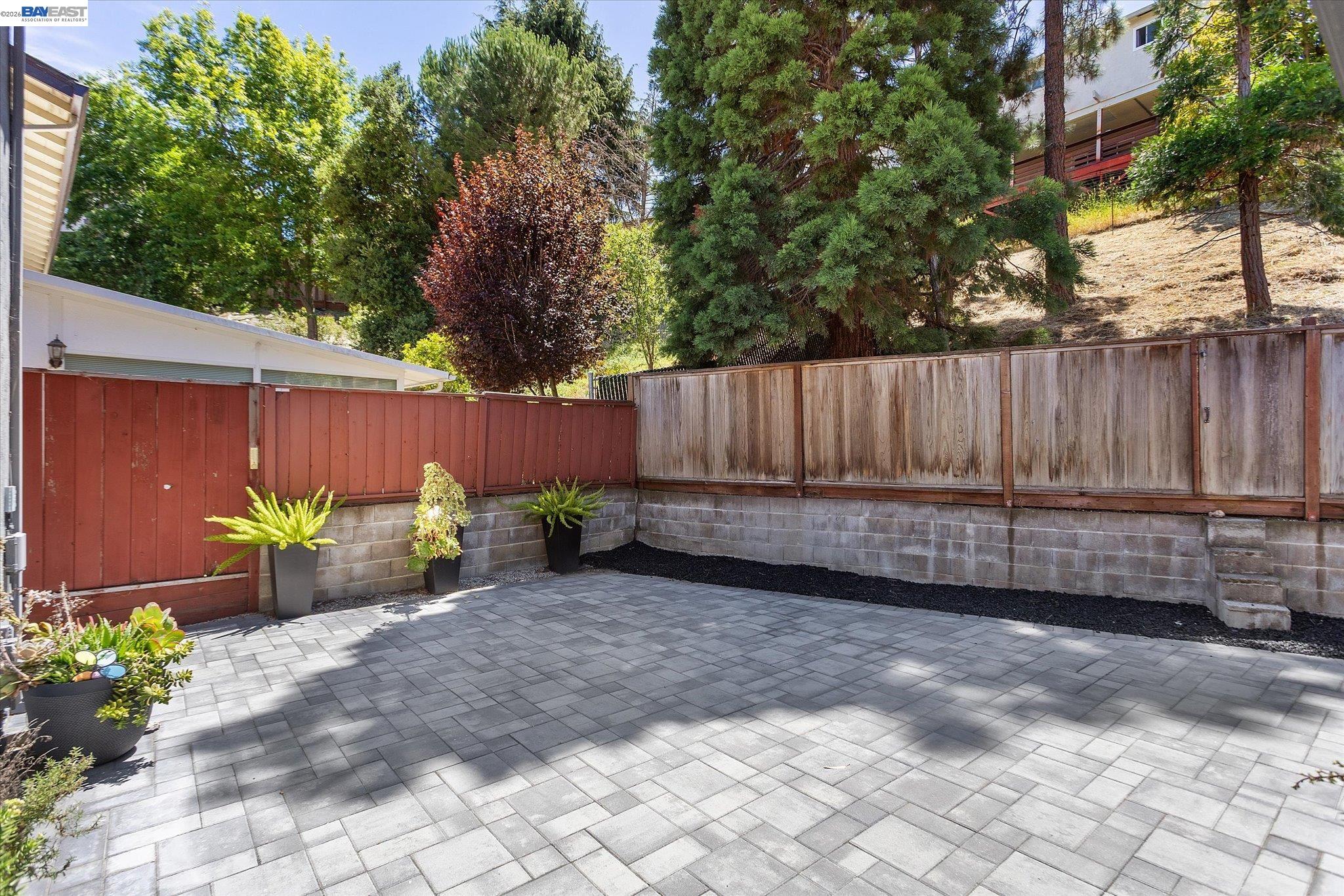 16683 Kildare Road Castro Valley, CA 94546 - Photo 70 of 77 a view of a backyard with potted plants and large tree