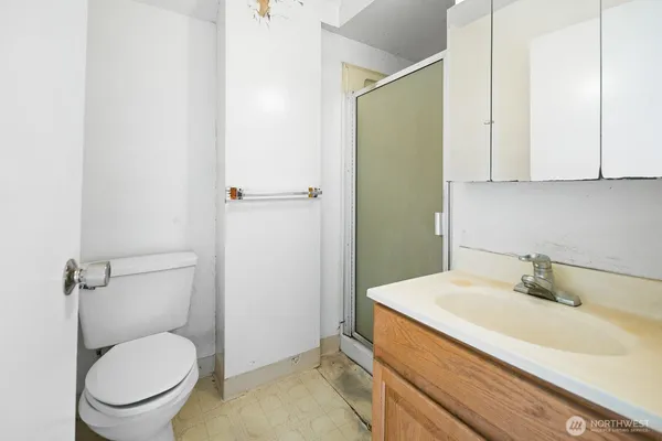 a bathroom with a sink toilet and vanity