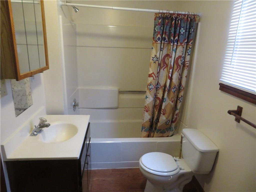 333 West Brady Street Butler, PA 16001 - Photo 8 of 9 a bathroom with a sink a toilet and shower