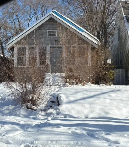 a view of a house with a snow in the yard