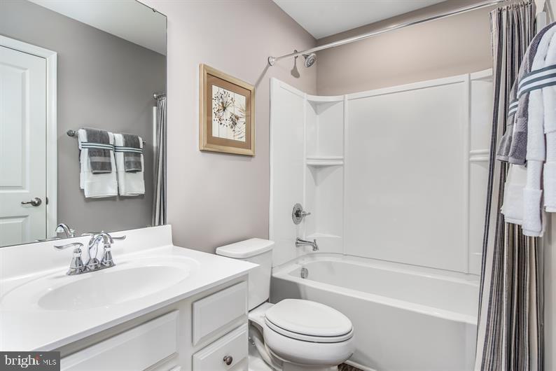 7911 Mine Run Road Hanover, MD 21076 - Photo 16 of 27 a bathroom with a sink toilet and shower