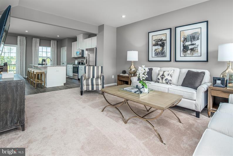 7911 Mine Run Road Hanover, MD 21076 - Photo 8 of 27 a living room with furniture and a table