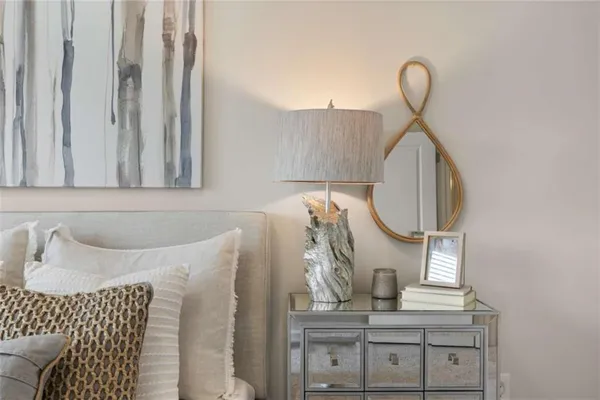 a bedroom with a bed and cabinets
