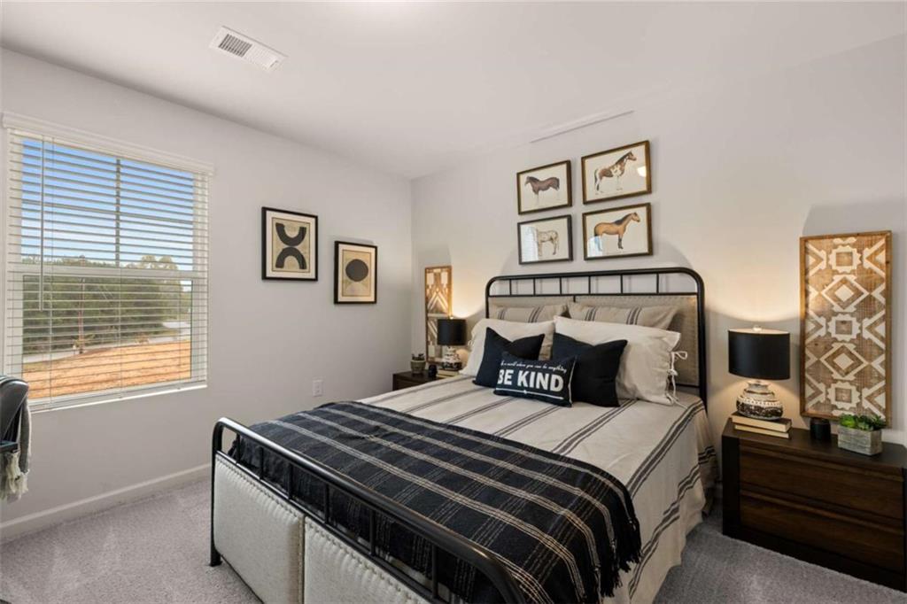 1047 Merritt Drive, Unit 88 Villa Rica, GA 30180 - Photo 10 of 47 a bedroom with a bed and a window
