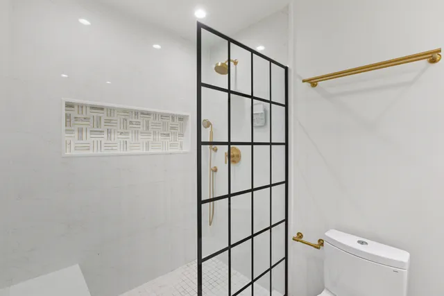 a bathroom with a shower and a window