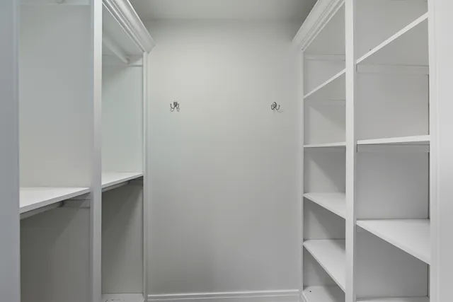 a view of an empty walk in closet