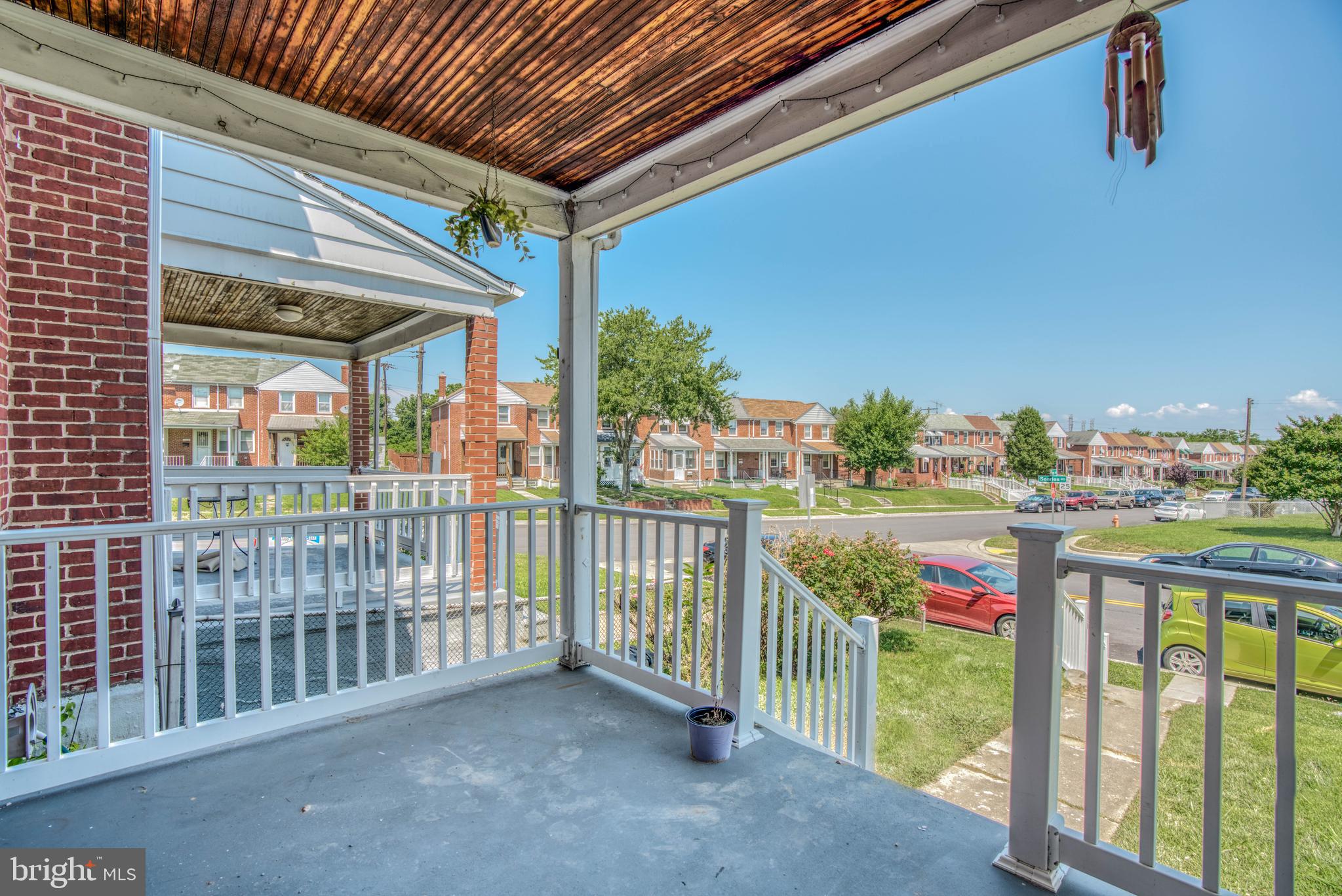 Front porch with views of beautiful neighborhood.