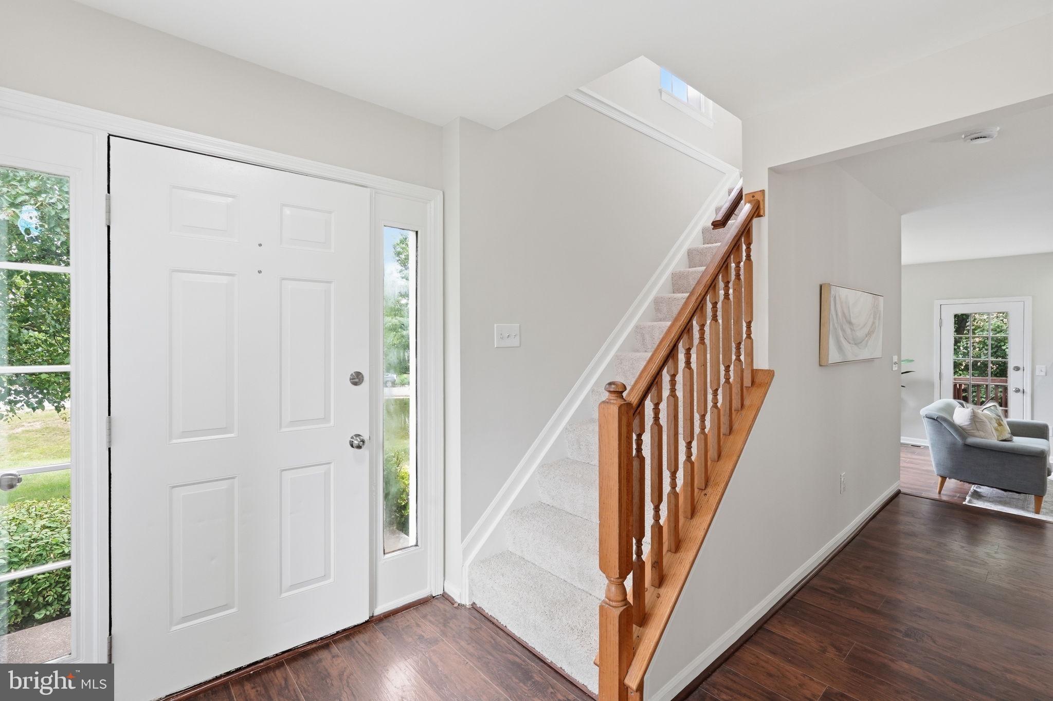 6010 Bingley Road Alexandria, VA 22315 - Photo 20 of 50 a view of a hallway with wooden floor staircase and windows