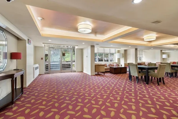 a large room with lots of tables and chairs