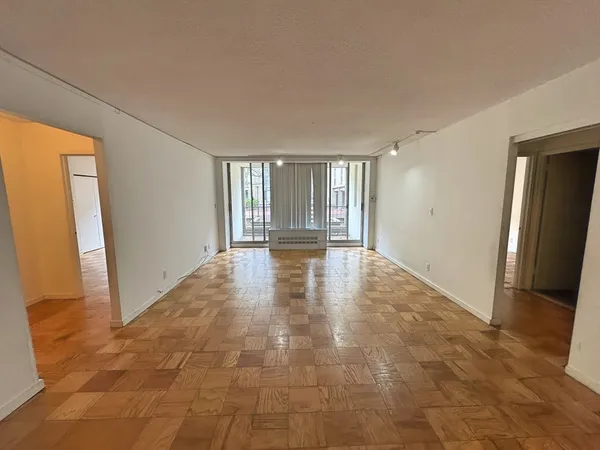 a view of an empty room and window