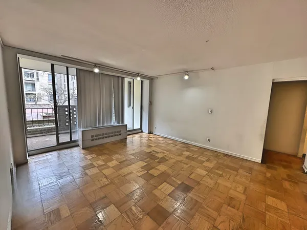 a view of an empty room with a window