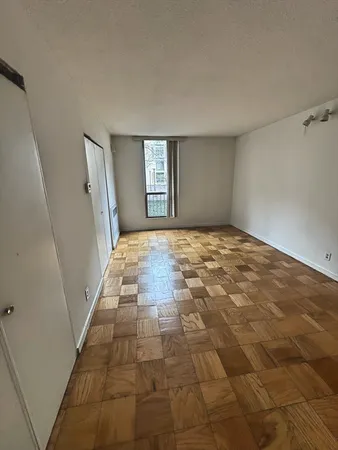 a view of an empty room and window