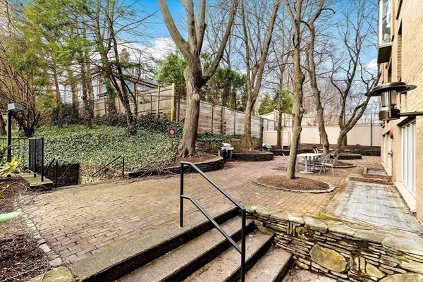 a view of a backyard with sitting area