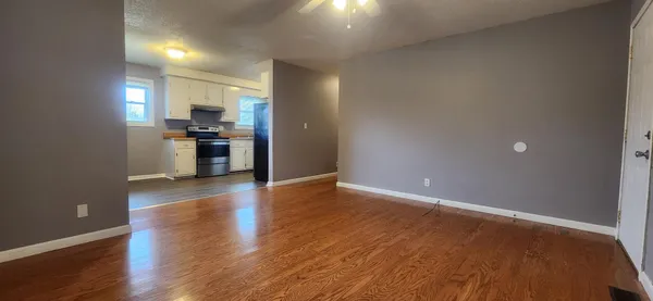 a view of a kitchen with a sink and a stove top oven