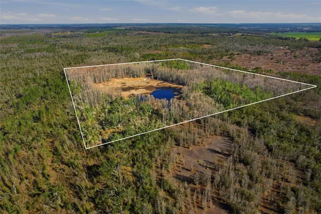 a view of a balcony with a yard