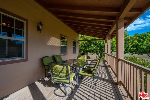 a kitchen with granite countertop cabinets stainless steel appliances and a counter space