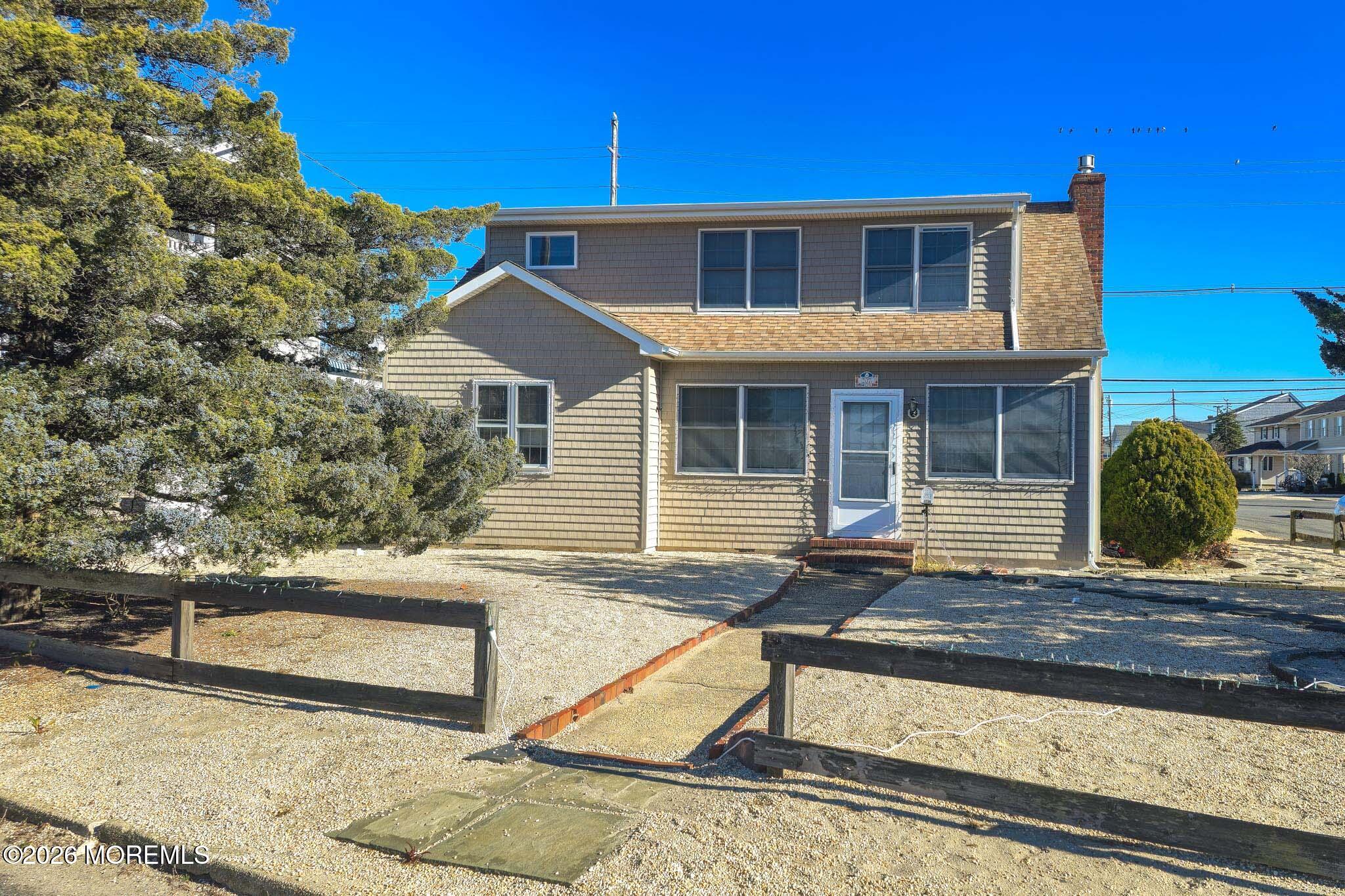 207 Bay Boulevard Lavallette, NJ 08735 - Photo 22 of 62 a front view of a house with garden