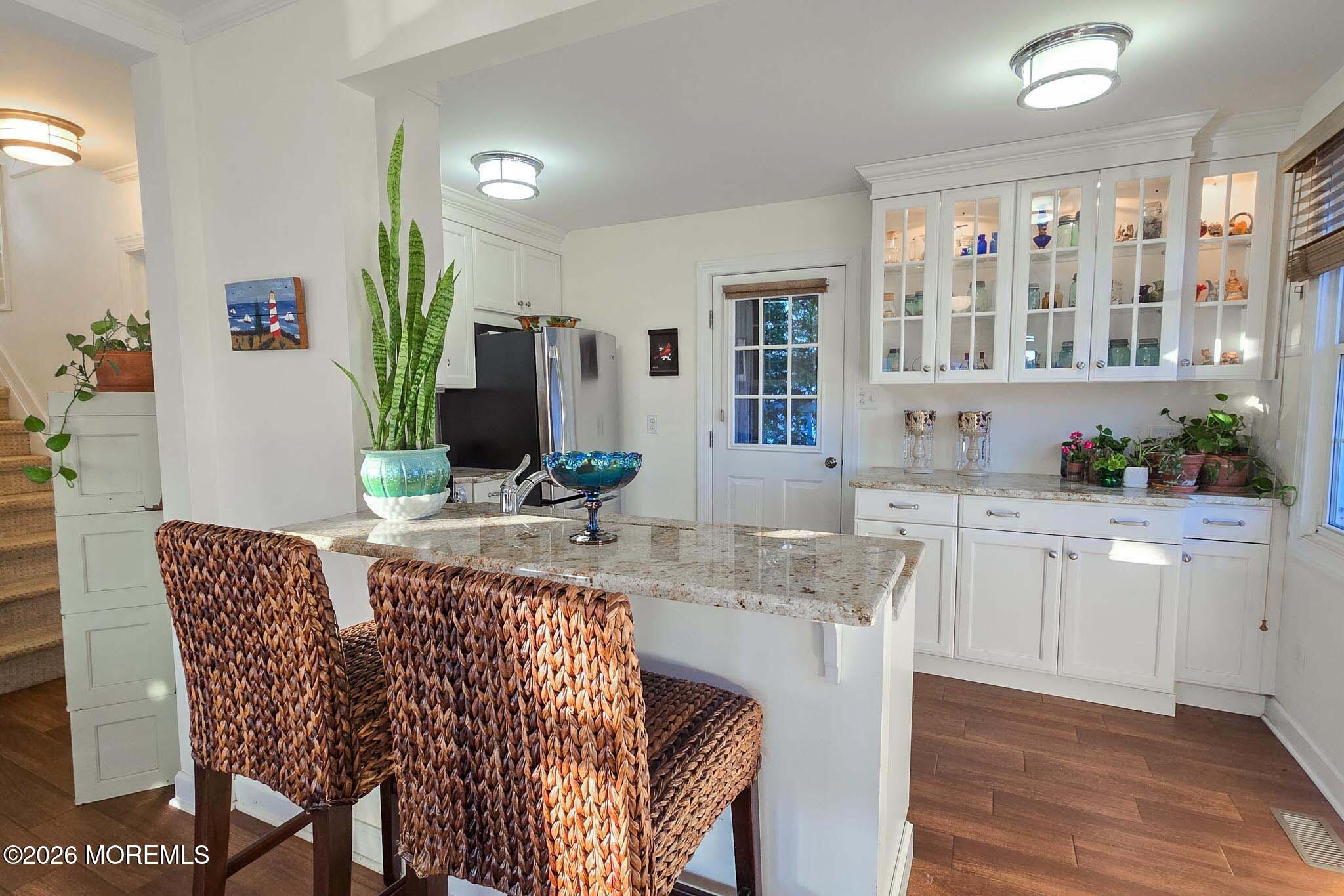 207 Bay Boulevard Lavallette, NJ 08735 - Photo 30 of 62 a kitchen with stainless steel appliances granite countertop a dining table chairs and granite counter tops