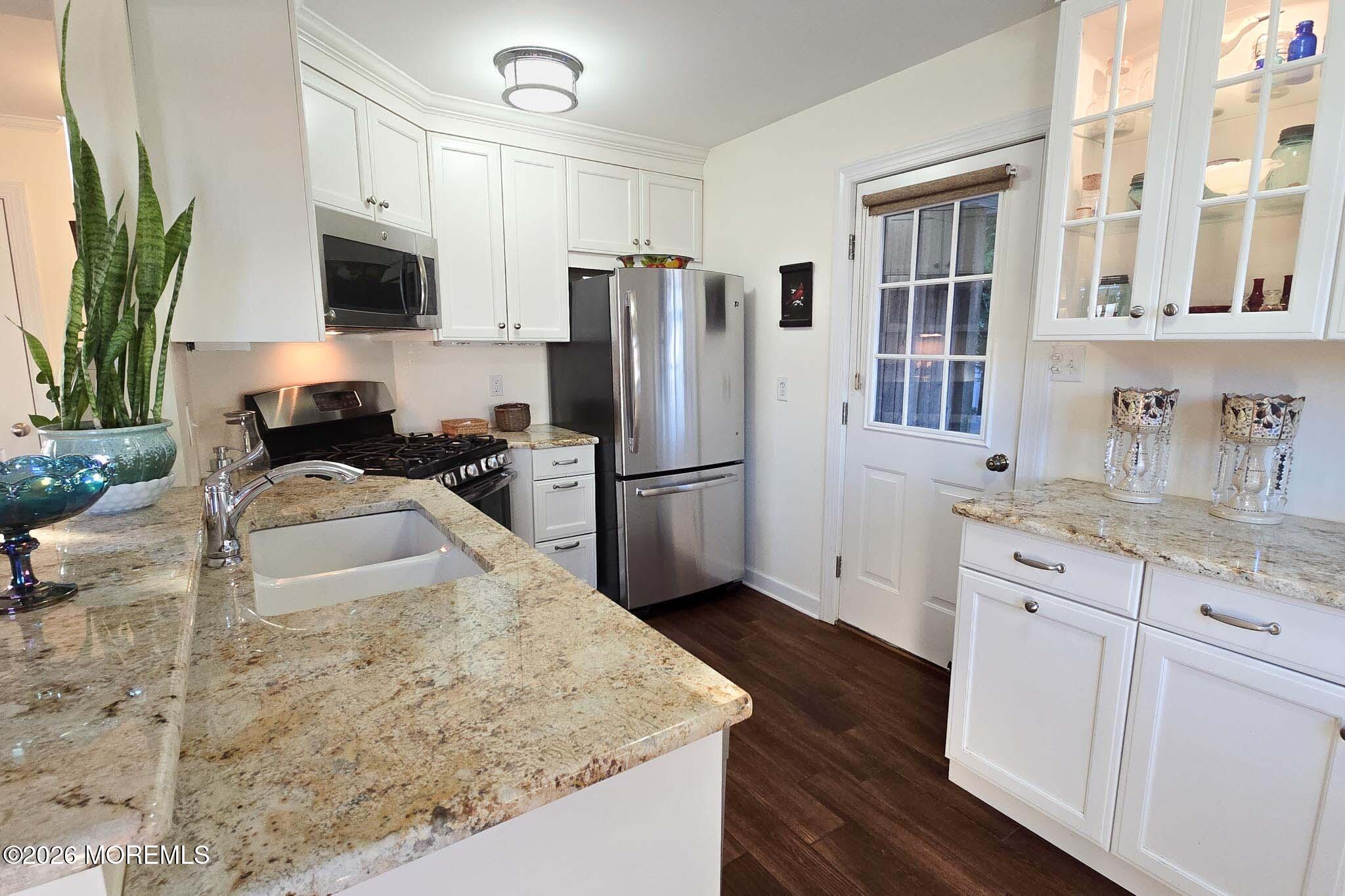 207 Bay Boulevard Lavallette, NJ 08735 - Photo 31 of 62 a kitchen with granite countertop a sink stove and refrigerator