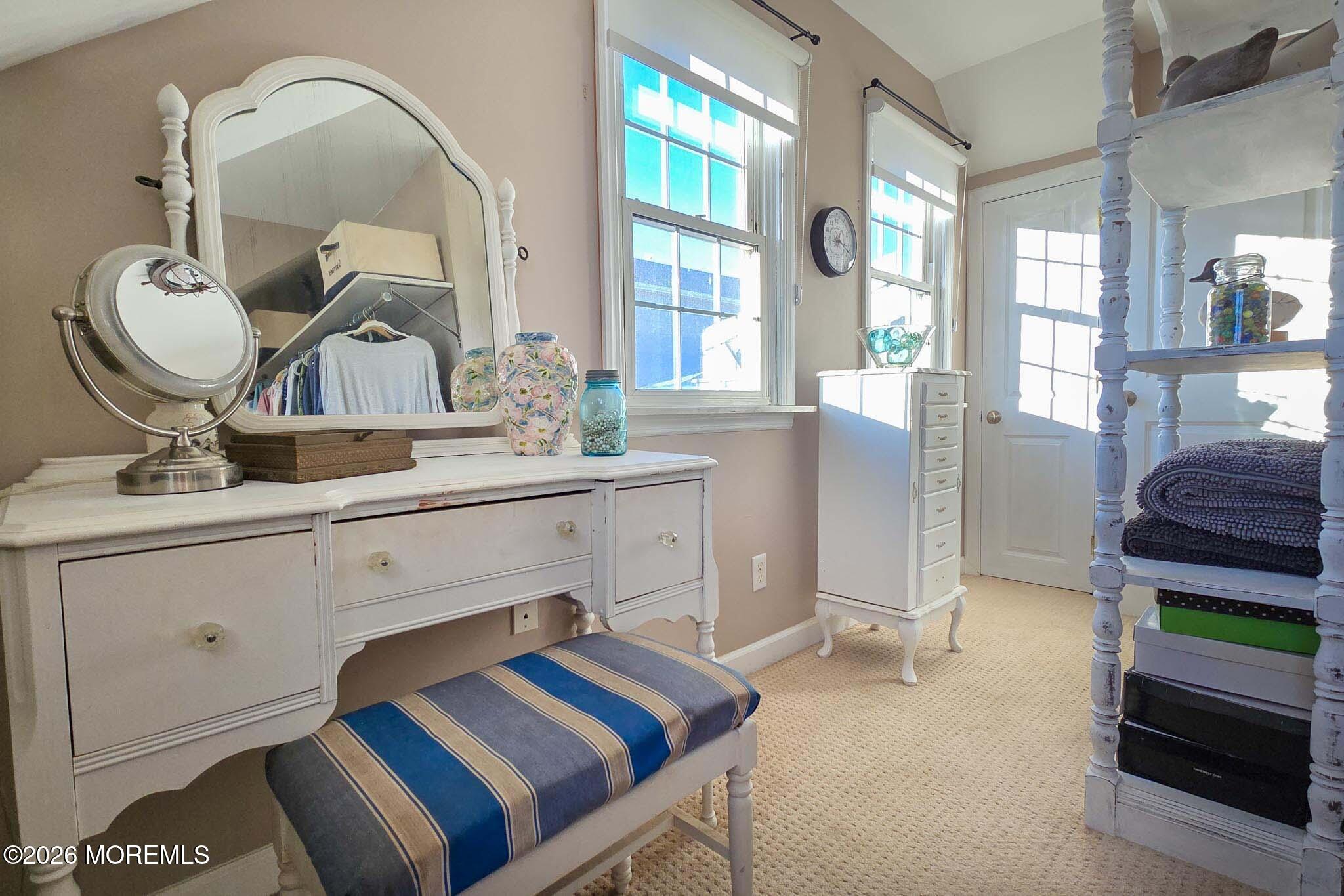 207 Bay Boulevard Lavallette, NJ 08735 - Photo 37 of 62 a bedroom with a bed and a dresser