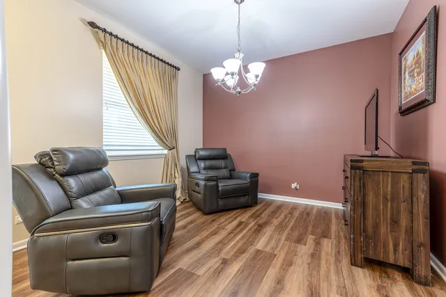a living room with furniture a couch and a window