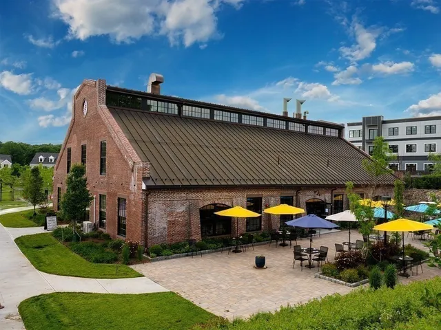 a view of a house with patio and sitting area