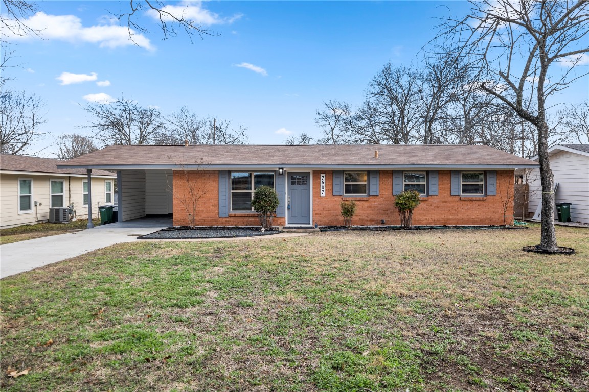 7607 Creston Lane Austin, TX 78752 - Photo 1 of 1 front view of a house with a yard