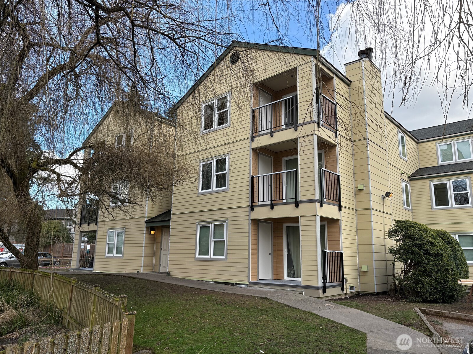 20328 Bothell Everett Highway, Unit B202 Bothell, WA 98012 - Photo 1 of 1 a view of a white house with a yard