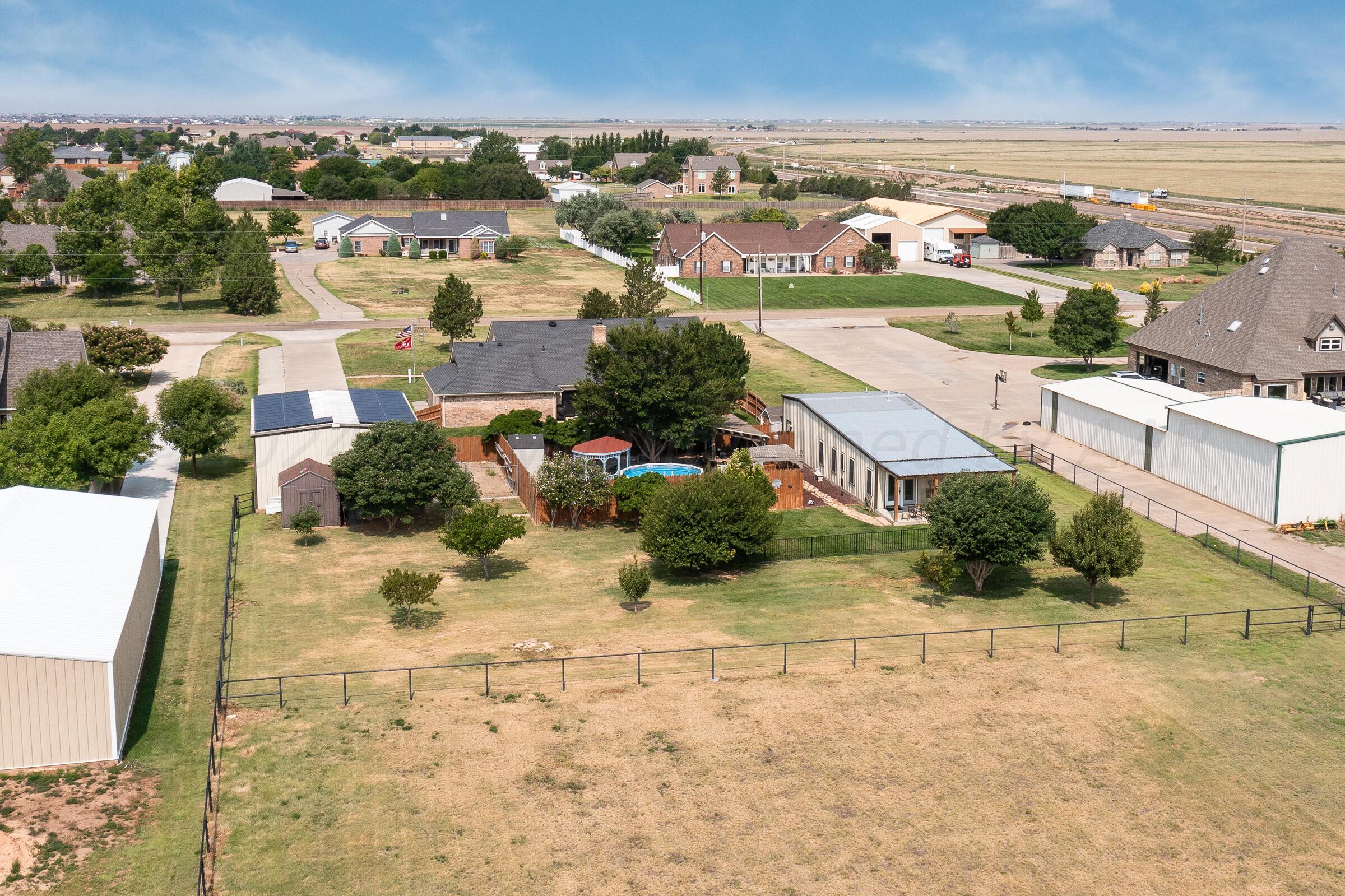 8921 Greyhawk Road Amarillo, TX 79119 - Photo 21 of 56 an aerial view of residential houses with outdoor space