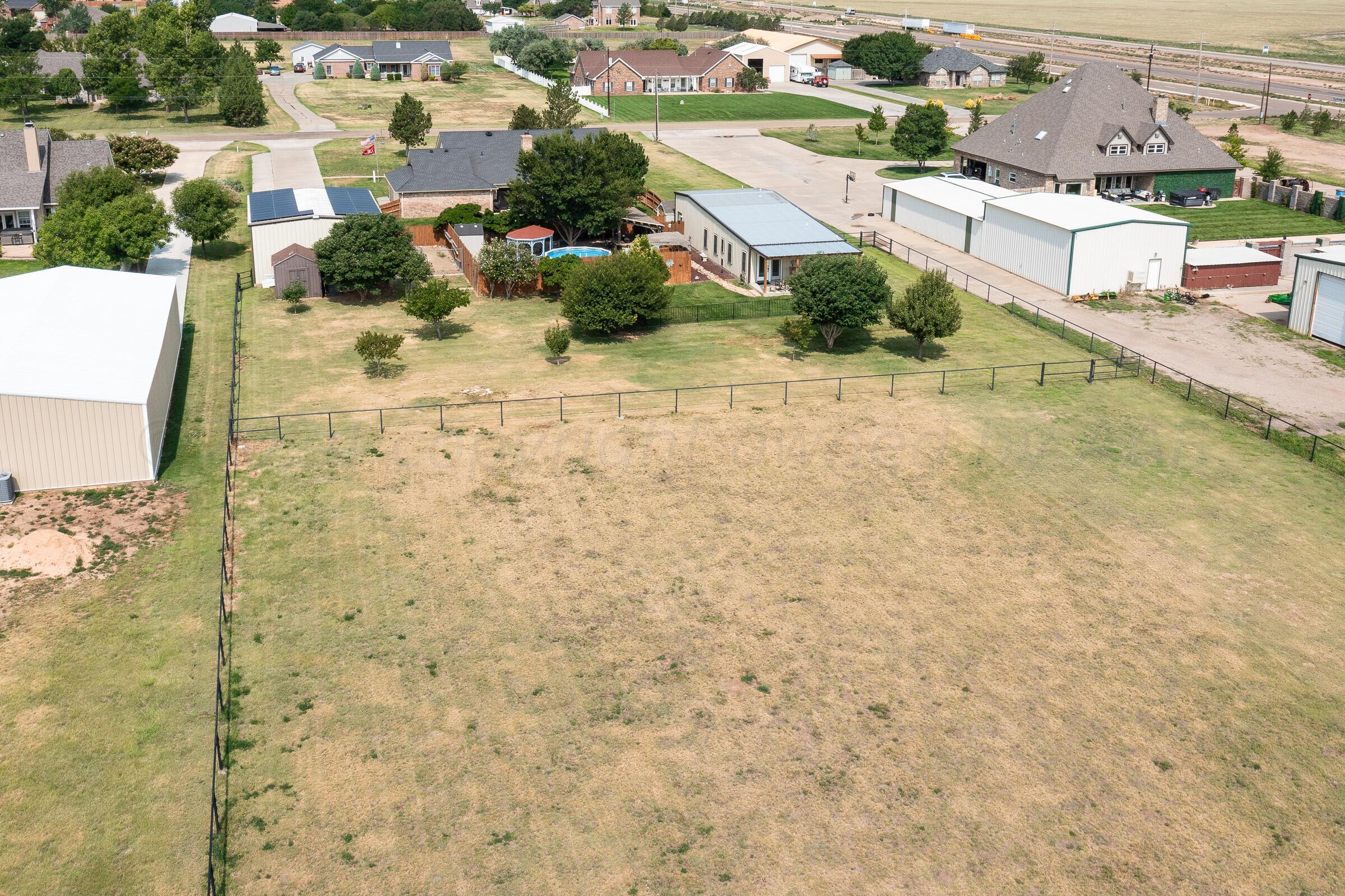 8921 Greyhawk Road Amarillo, TX 79119 - Photo 22 of 56 an aerial view of residential houses with outdoor space